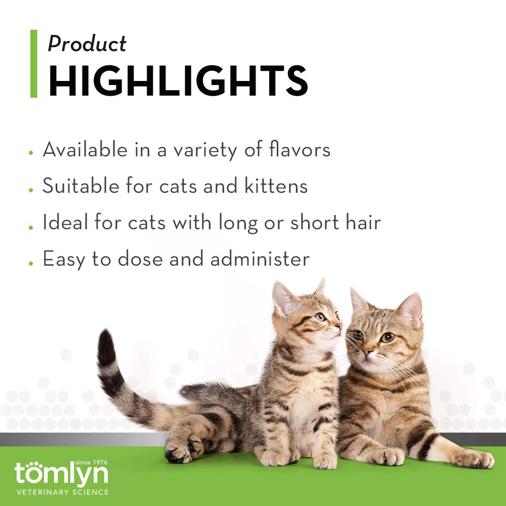 Tomlyn Laxatone cat licking paw after application, tasty hairball gel.